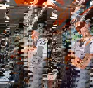 baristas in a coffee shop working in a happy environment